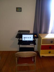 a desk with a laptop computer on top of it at Zoo Town House with Sauna in Missoula