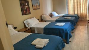 Ліжко або ліжка в номері Hotel Vlora