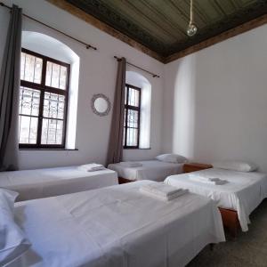 Ein Bett oder Betten in einem Zimmer der Unterkunft Rhodes Youth Hostel
