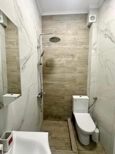 a bathroom with a toilet and a sink and a tub at Sea La Vie - Premium in Polychrono +9 photos