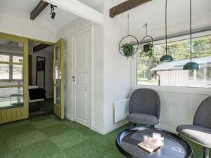 Posezení v ubytování Holiday Home Hölick Minichalet 2 by Interhome