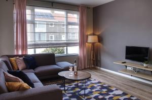 โทรทัศน์และ/หรือระบบความบันเทิงของ Volledig Gerenoveerd - Huis aan het strand -Nieuwstraat 4