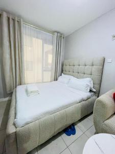 En eller flere senge i et værelse på Comfy homes 2