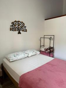 Postel nebo postele na pokoji v ubytování Recanto Casa Amarela + 26 fotografií