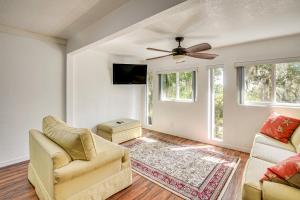 a living room with two chairs and a ceiling fan at 3 Mi to Ocala Natl Forest Trails Nature Escape in Salt Springs