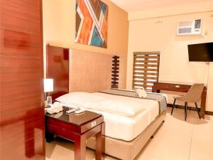 Postel nebo postele na pokoji v ubytování Casa Bocobo Hotel