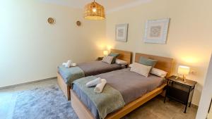 En eller flere senge i et værelse på Vista Azul Luxury Aparment