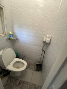 a bathroom with a toilet and two rolls of toilet paper at Vienibas prospekts in Jūrmala