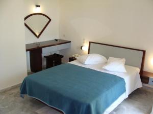 Posteľ alebo postele v izbe v ubytovaní Rodon Hotel