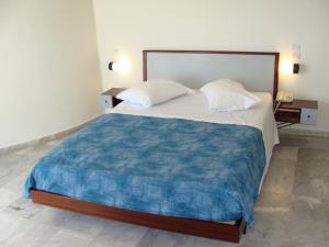 Posteľ alebo postele v izbe v ubytovaní Rodon Hotel