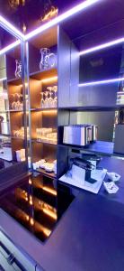 a kitchen with a counter top with aperature at Village Naturiste Cap d'Agde 224 Résidence de luxe Les jardins d'Eden "Réservée aux couples " in Cap d'Agde +9 photos