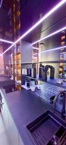 a kitchen with a sink and a counter top at Village Naturiste Cap d'Agde 224 Résidence de luxe Les jardins d'Eden "Réservée aux couples " in Cap d'Agde