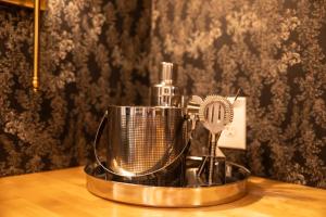 a metal fan sitting on top of a table at The Gas Lamp Hotel in Philadelphia