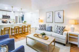 a living room with a couch and a table at Lazy Lagoon in Kiawah Island