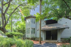a blue house with a window on top of it at Lazy Lagoon in Kiawah Island