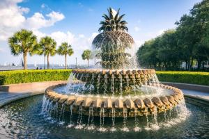 a fountain in a park with a pineapple at Lazy Lagoon in Kiawah Island