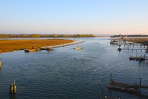 a view of a river with boats in the water at Lazy Lagoon in Kiawah Island