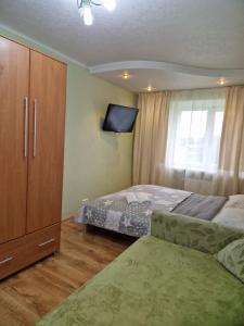 Ένα ή περισσότερα κρεβάτια σε δωμάτιο στο Sporta 2