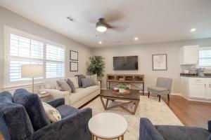a living room with a couch and a table at Cottage on Hughes in Fayetteville