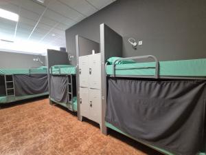 a row of bunk beds in a room at Albergue Argemira - Grupo Arcanos in Caldas de Reis