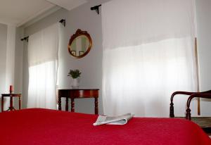 Posteľ alebo postele v izbe v ubytovaní Hostal Emilia