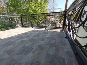 a black wrought iron railing on a balcony at Luxury home in the city centre in Prilep