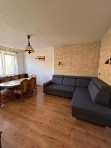 a living room with a couch and a table at Wonderful house in Sokolov