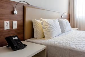 Postel nebo postele na pokoji v ubytování Rio Hotel by Bourbon Maringá + 22 fotografií