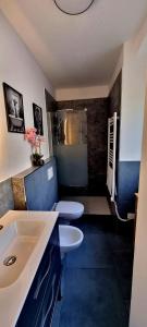 a bathroom with a sink and two toilets at Casa Enzo in Besozzo +68 photos