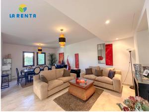 a living room with two couches and a table at Marassi Veneto villa in El Alamein