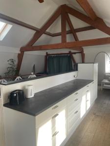 Kuchyň nebo kuchyňský kout v ubytování Duplex centre bruxelle