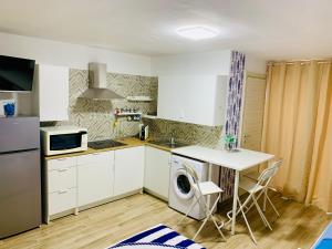 Kuchnia lub aneks kuchenny w obiekcie Sunrise
