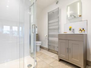 a bathroom with a shower and a sink and a toilet at 2 Bed in Longtown 79176 in Longtown +37 photos