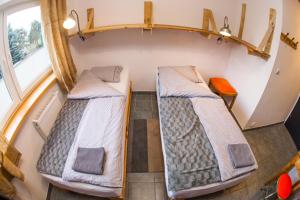 Posteľ alebo postele v izbe v ubytovaní Trafo Base Camp