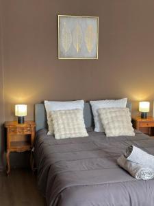 Ένα ή περισσότερα κρεβάτια σε δωμάτιο στο Appartement de la Gare