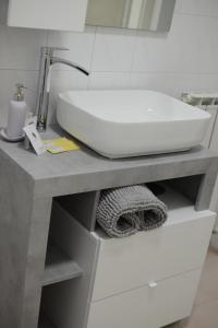 a bathroom with a sink on a counter at La Fenice Suite in Perugia