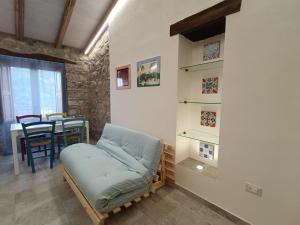 a living room with a couch and a table at A Casuzza in Caronia
