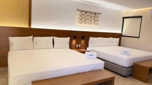 Postel nebo postele na pokoji v ubytování Hotel Makkan Boca