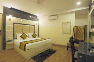 Postel nebo postele na pokoji v ubytování Hotel Plazzo At Delhi International Airport