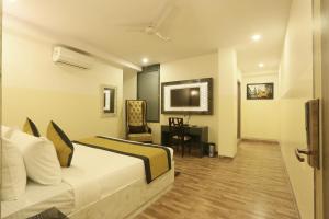 Postel nebo postele na pokoji v ubytování Hotel Plazzo At Delhi International Airport
