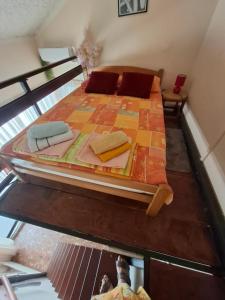 a bed in the middle of a room at Paulino Rooms in Herceg-Novi