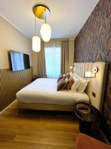 Postel nebo postele na pokoji v ubytování Mavi Luxury Suites