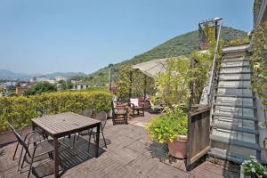 a patio with a table and a table and chairs at Hepburn Holiday Home in Salerno +82 photos