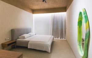 Ένα ή περισσότερα κρεβάτια σε δωμάτιο στο Elegant Cocktailbox apartment lungomare