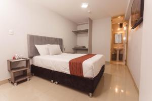 Postel nebo postele na pokoji v ubytování Sumaq Cusco Suites