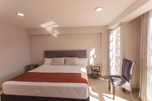 Postel nebo postele na pokoji v ubytování Sumaq Cusco Suites