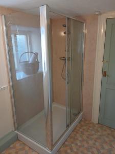 a shower with a glass door in a bathroom at Forden House in Dolgellau +34 photos