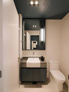 a bathroom with a sink and a toilet and a mirror at Novinho, Central e c/ Garagem! in Pelotas