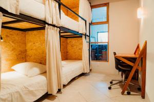 Voodi või voodid majutusasutuse Kualena Hostal toas
