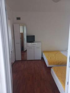 Postel nebo postele na pokoji v ubytování ApartmaniNET